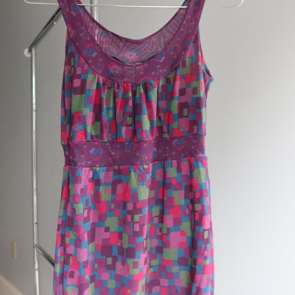 Purple and pink Y2K tank with a floral pattern.‎ Mesh detailing.